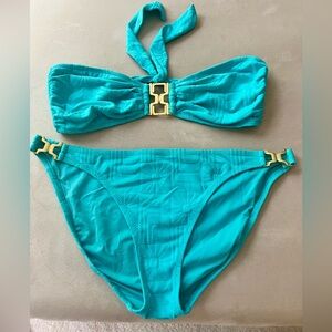 NWOT!  Sea blue Trina Turk size 12 bikini with metal detailing.